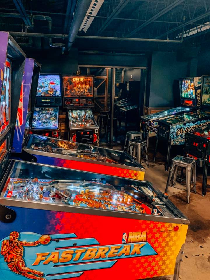 room full of different arcade games, mainly different versions of pinball