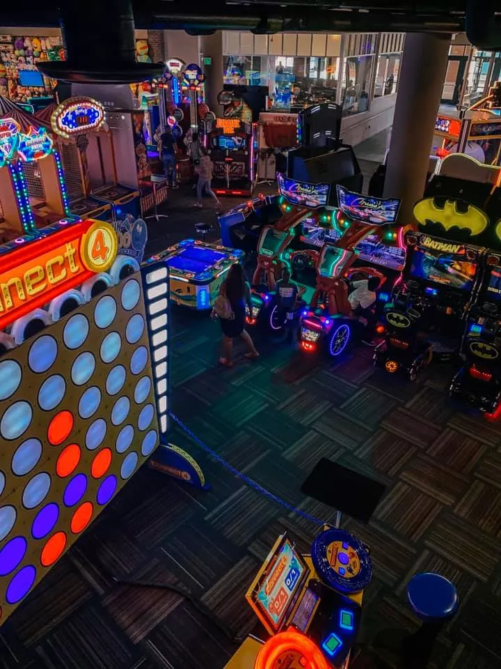 Overhead shot of numerous arcade games including life size connect four at Gametime Tampa