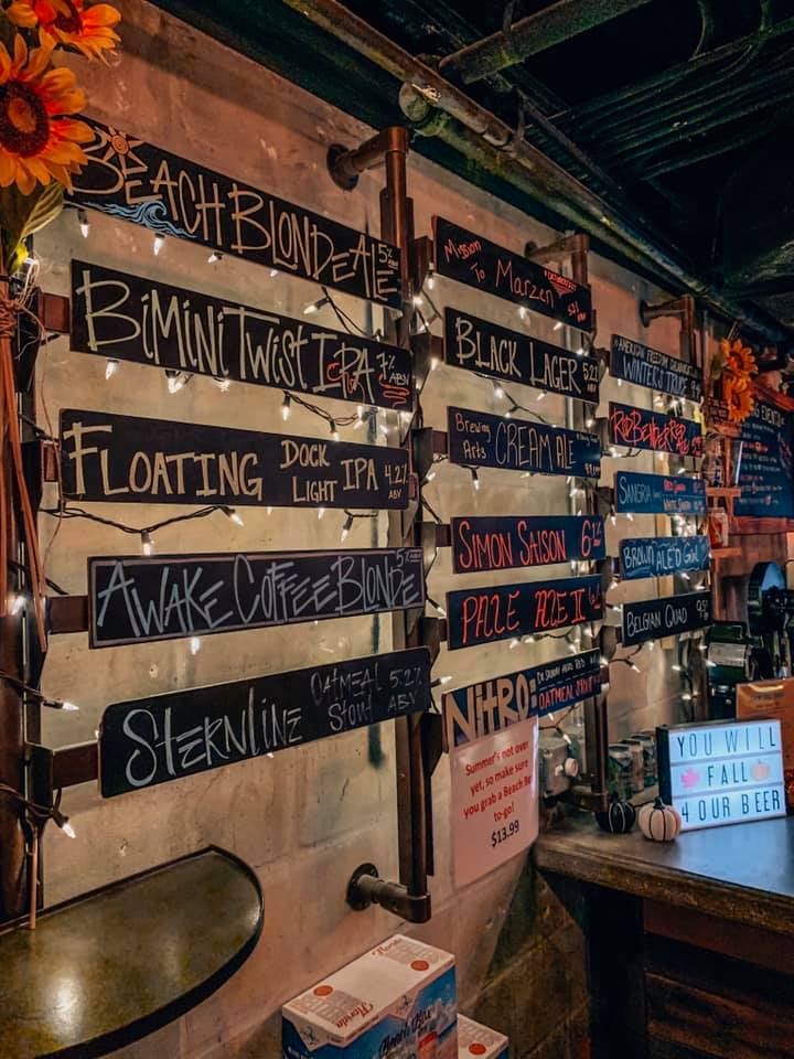 Chalk written names of the tap list, decorated with white lights