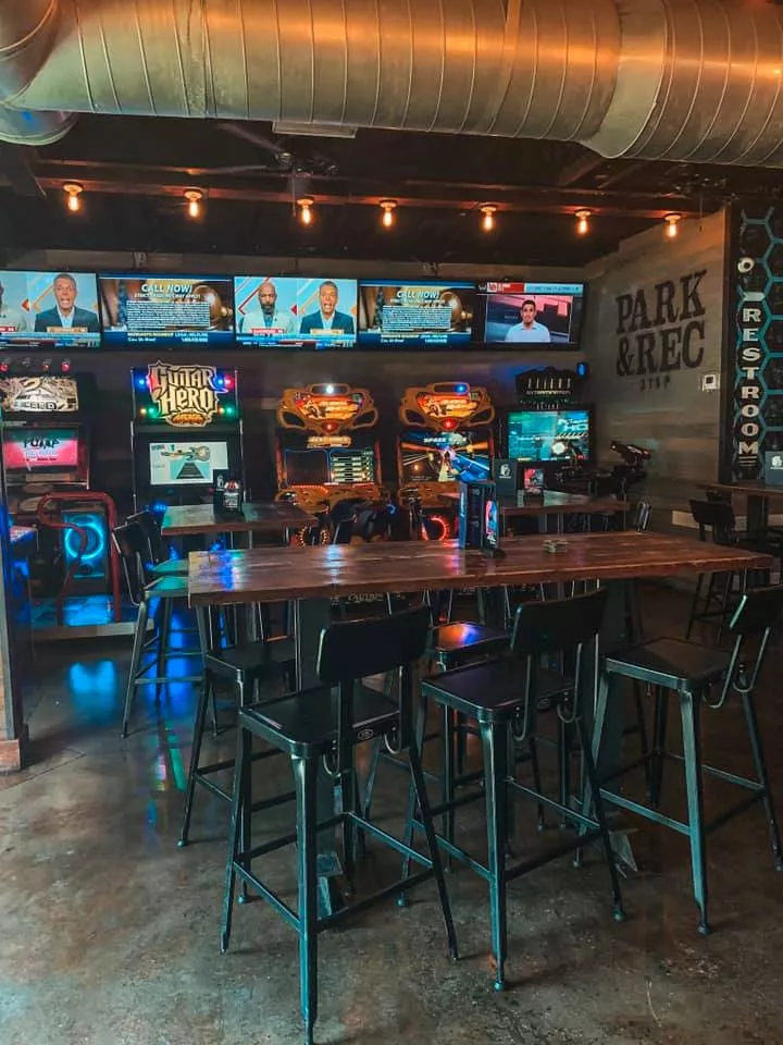 Indoor game area at Park and Rec with several arcade games