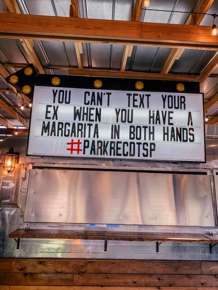 sign at Parks and Rec in downtown St. Pete that reads "You cant text your ex when you have a margarita in both hands"