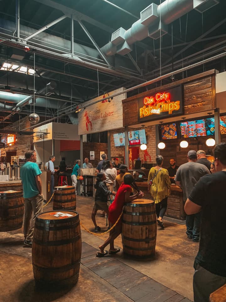 inside of morgan street food hall. Showing some seating areas as well as vendors