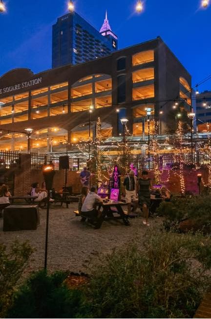 Outside Watts and Ward at night in downtown Raleigh