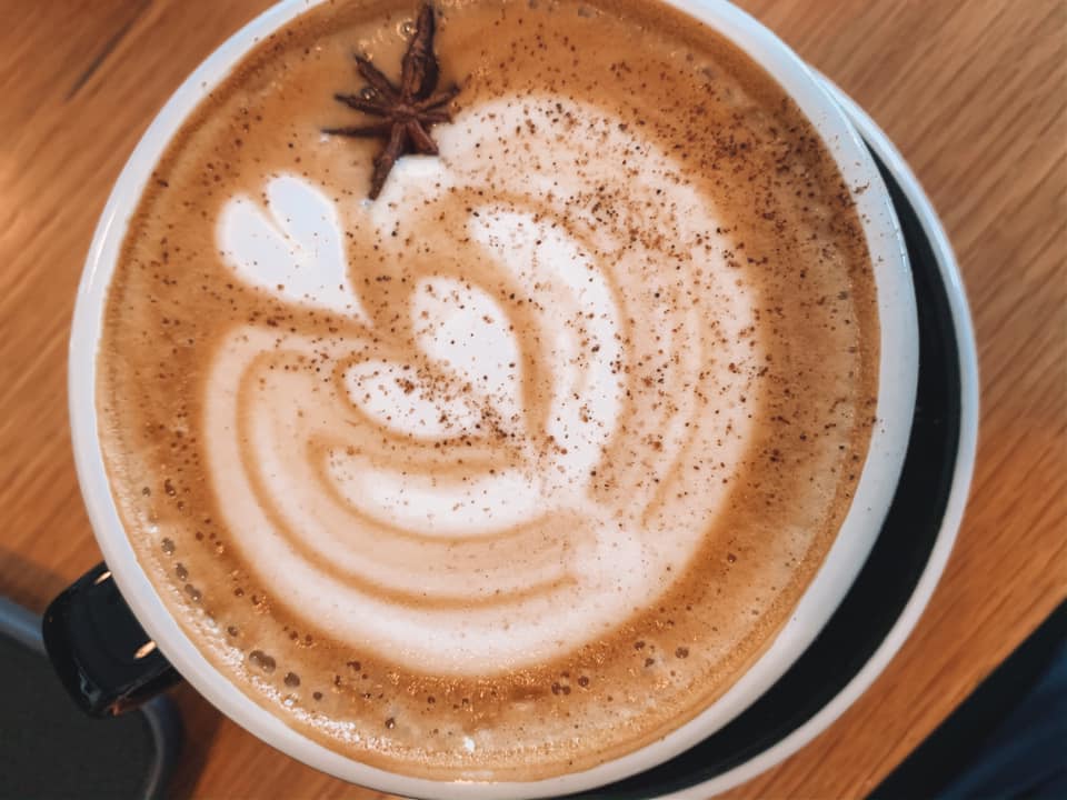 Beautifully crafted latte with a design on the foam at Bandit-- a coffee shop in St. Petersburg, Florida