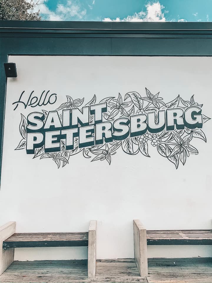 "hello Saint Petersburg" mural on the outside of a coffee shop