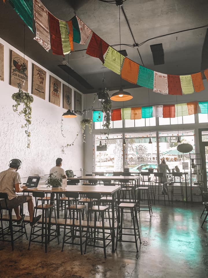 numerous long high tops for seating at a coffee shop in st. pete