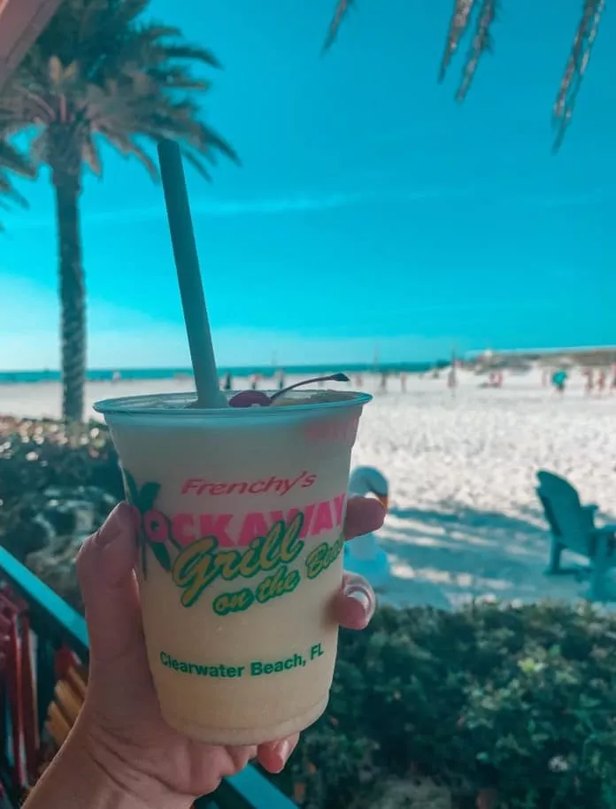 Enjoying a beachy frozen cocktail from Frenchy's