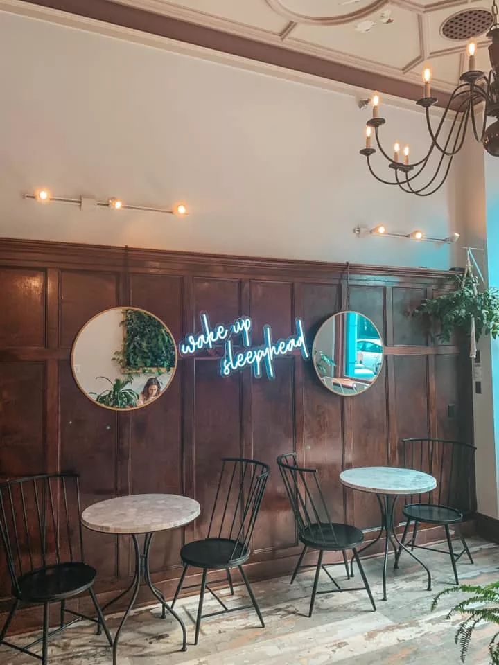 cute "wake up sleepyhead" sign inside coffee shop