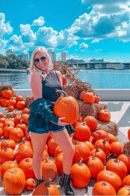 Woman at a pumpkin patch in downtown Tampa