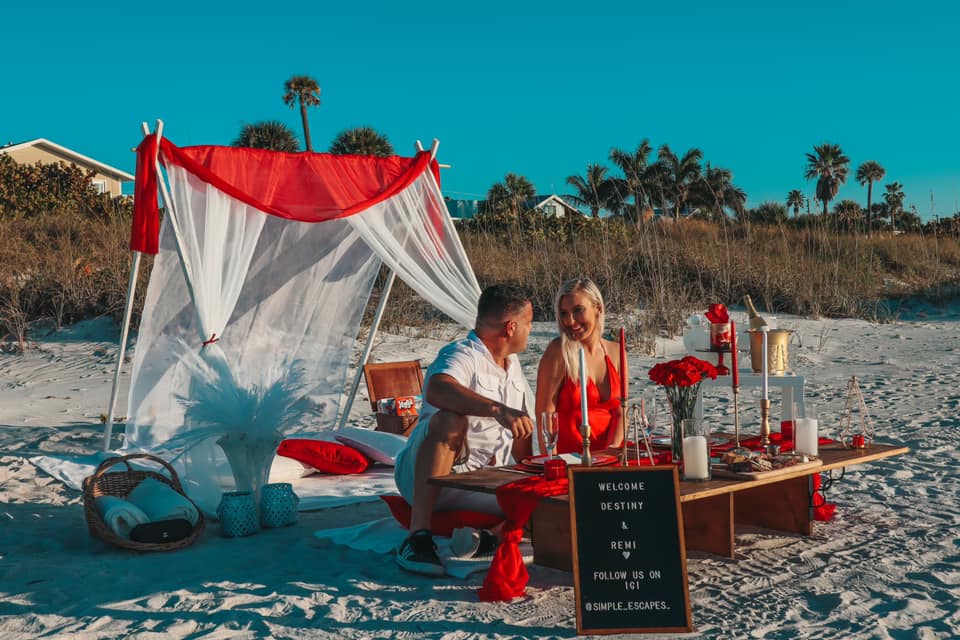 Couple on romantic beach picnic date. Romantic date idea for Tampa Bay