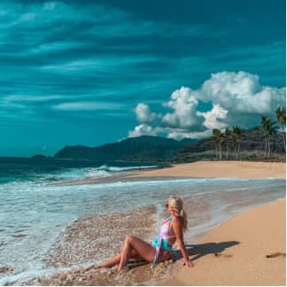 woman laying on the beach in Oahu Hawaii