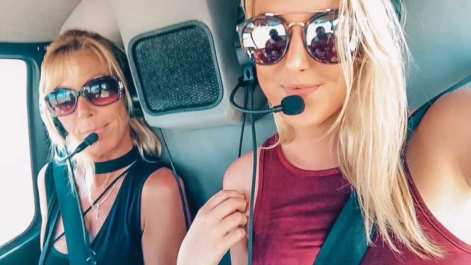Mother and daughter getting ready for takeoff in their helicopter ride