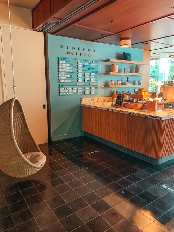 Floating chair and walk up counter area inside of Hideout Coffee in Honolulu