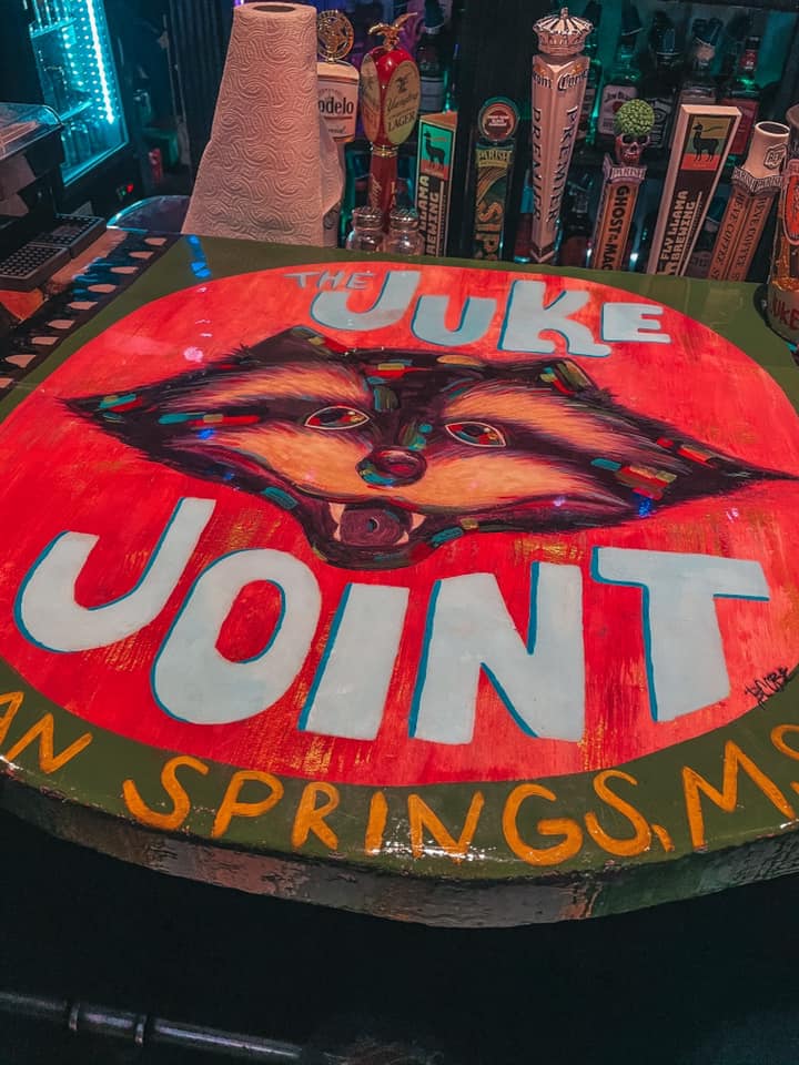 Juke Joint art on the bar with their raccoon mascot