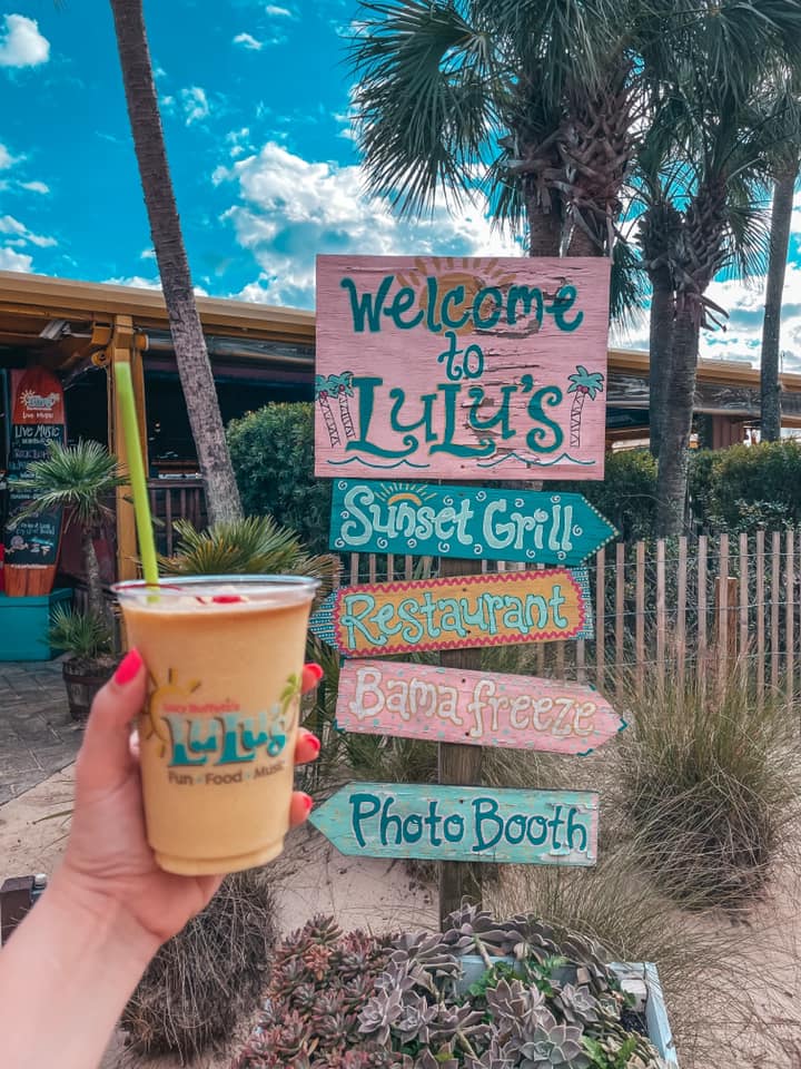 Mango pina colada and Lulu's colorful signage that says "Welcome to Lulu's"