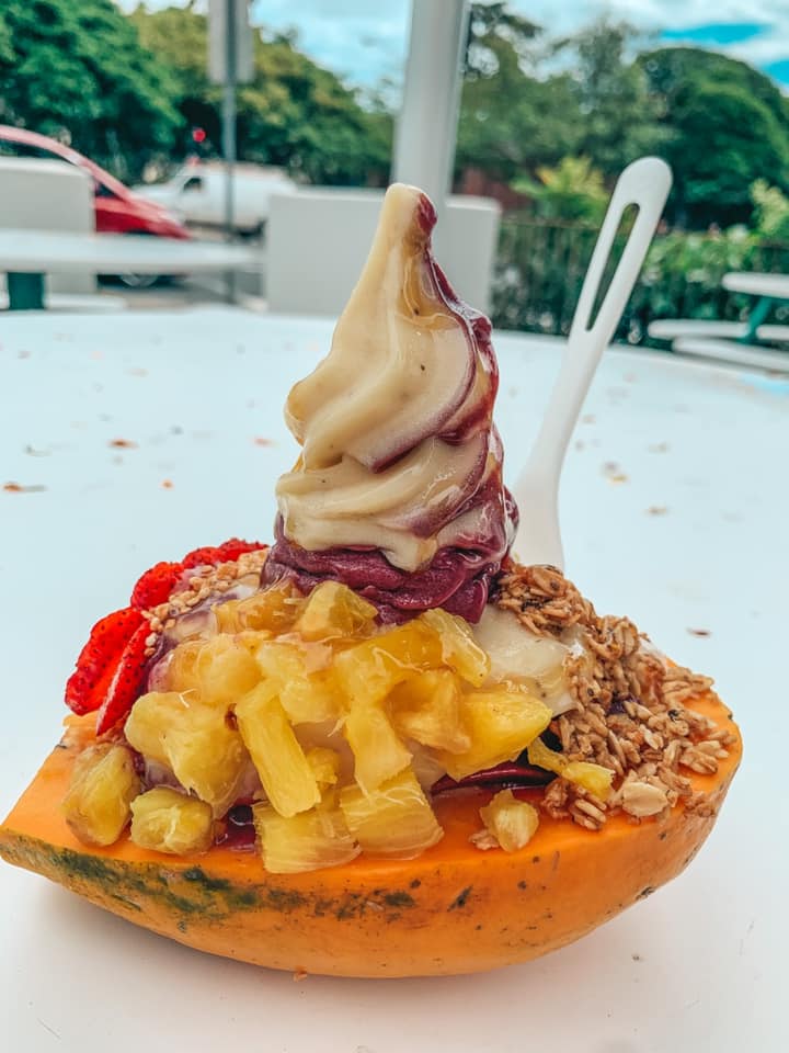 Banan in a papaya boat with fruit and honey toppings