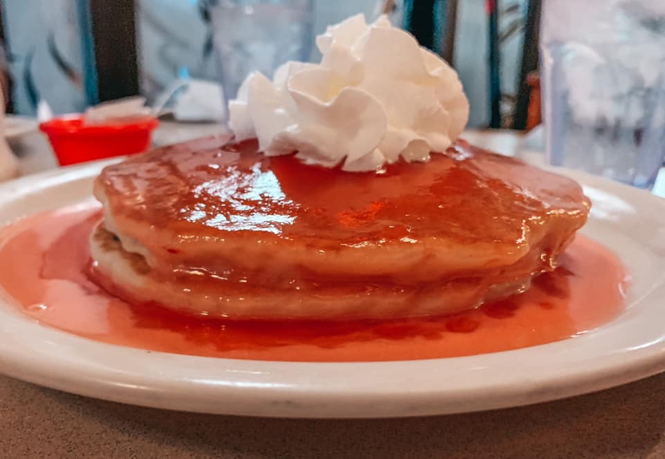 Guava Pancakes with whipped cream on top