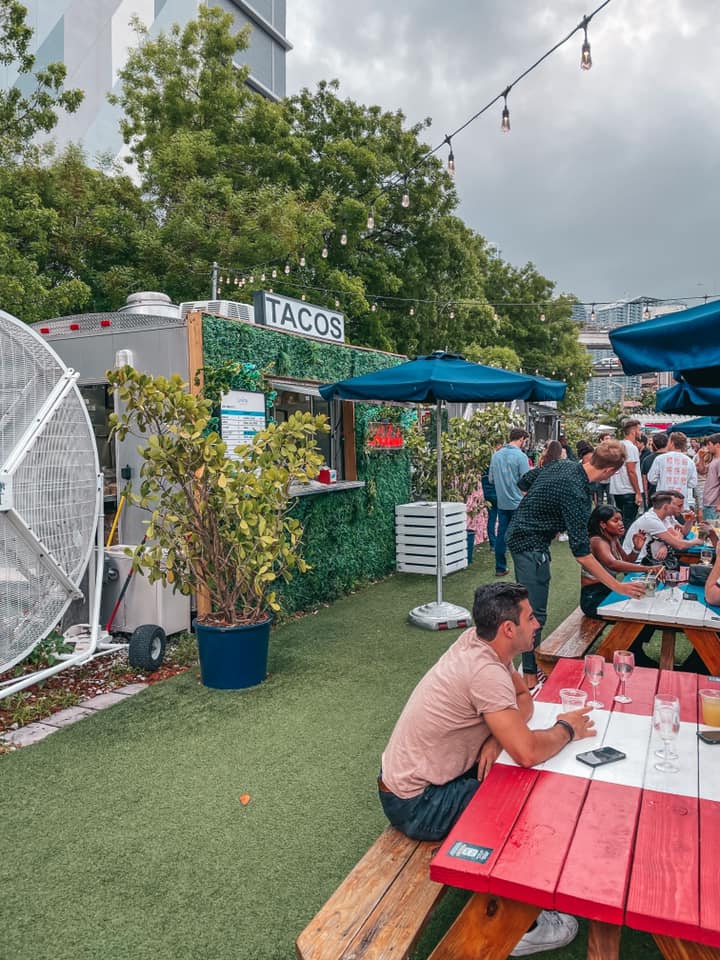 Food vendors and people gathering at The Wharf Miami