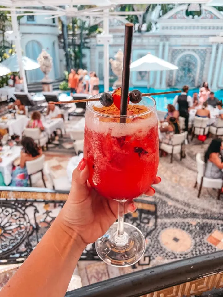 Fun cocktail with gold flakes in it at Versace Mansion in Miami