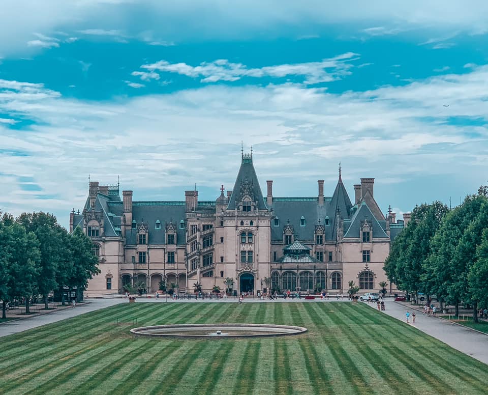 View of the Biltmore home on a partially cloudy day. One of the most popular things to do in Asheville