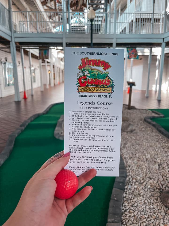 Putt putt rules held up in front of course at Holiday Inn