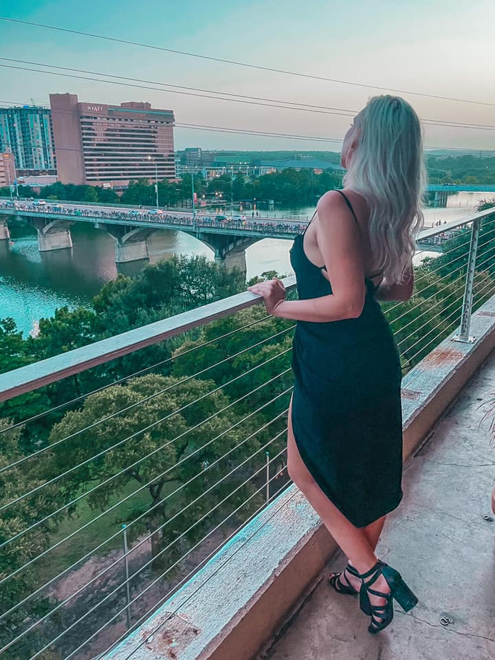 Woman enjoying the views from Austin rooftop bar P6