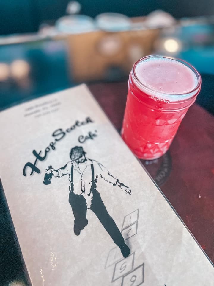 Pink sour beer and Hopscotch Cafe menu in Dunedin Florida