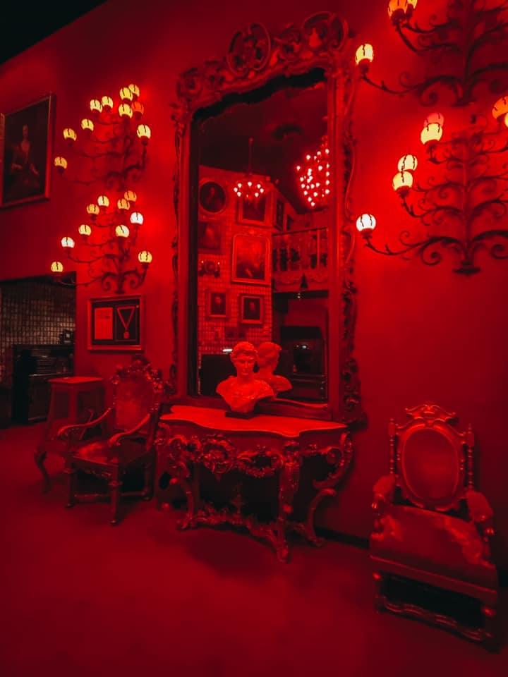 Lobby area of Bern's Steakhouse with red lights for date night restaurants