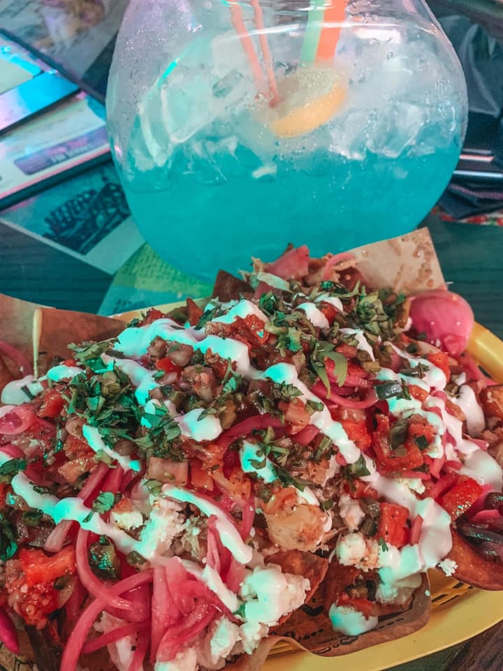 seafood nachos and a blue fish bowl drink from No Vacancy bar