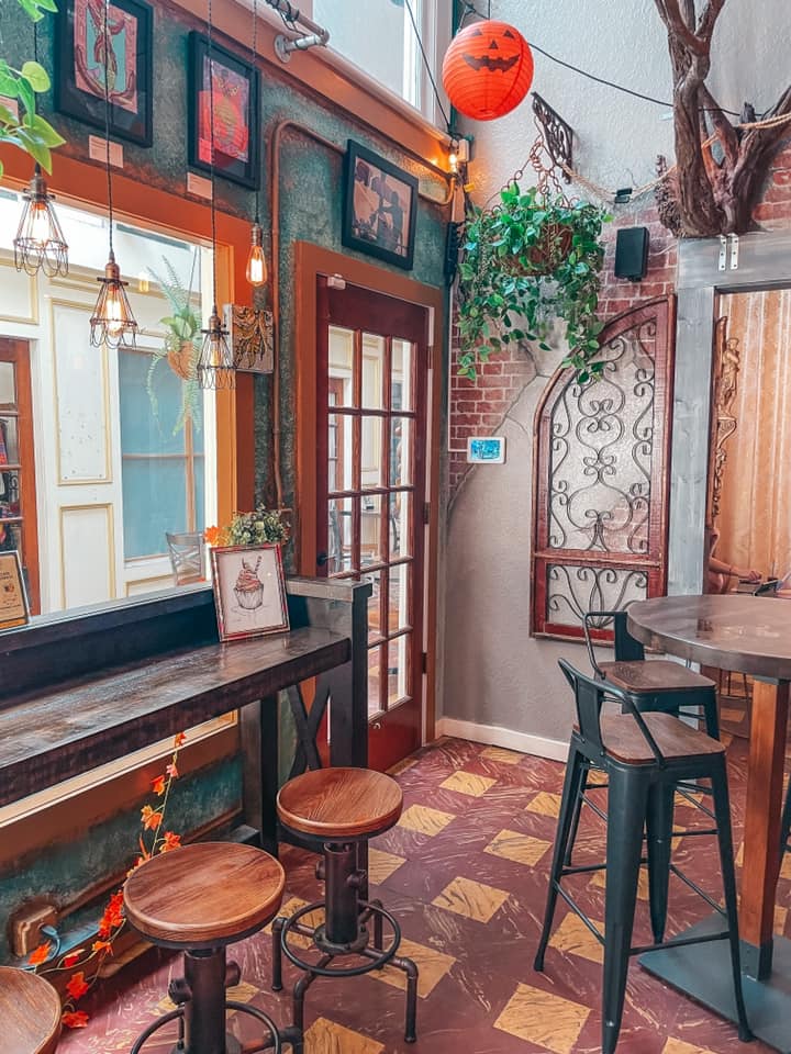 Adorable seating area with stools and a high top at Crislip Cafe in downtown St. Pete