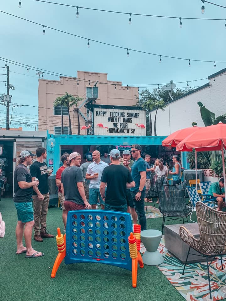 Outdoor area busy with people during the day at No Vacancy