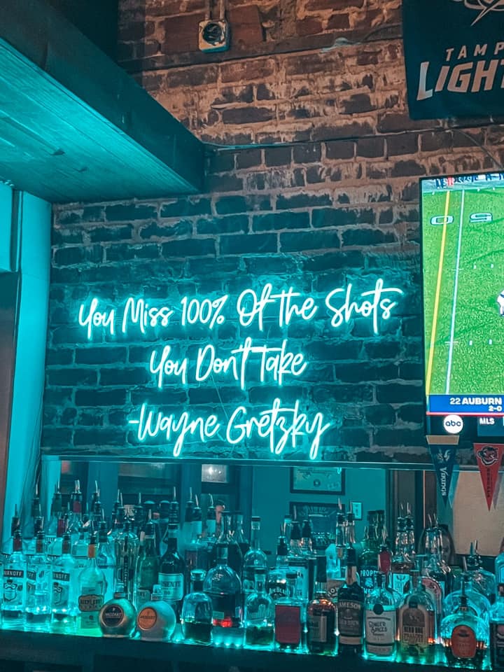 "you miss 100% of the shots you don't take" neon sign at Pour Judgement in downtown St. Pete