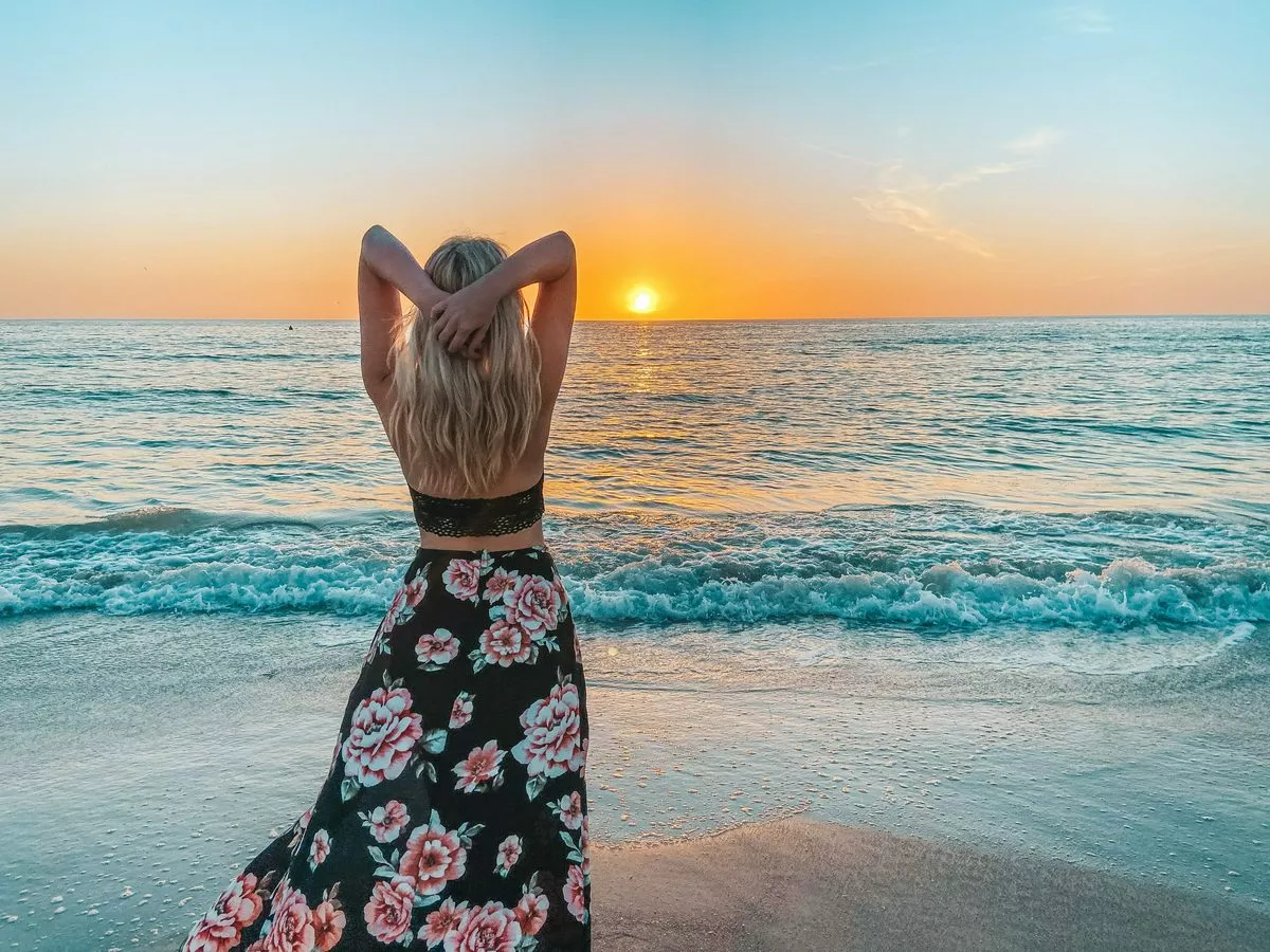 Woman looking out into the sunset on St. Pete Beach