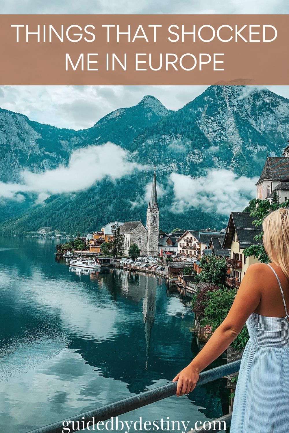 Woman staring out at lake in Europe. Things that shocked me in Europe