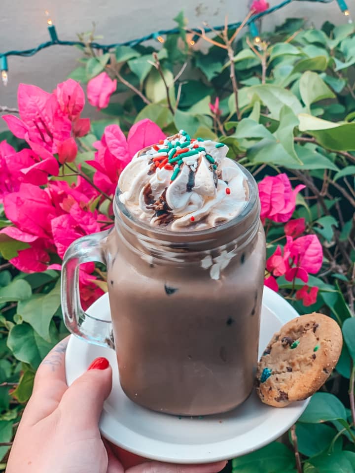 The Attic Cafe cookie latte with whipped cream and sprinkles