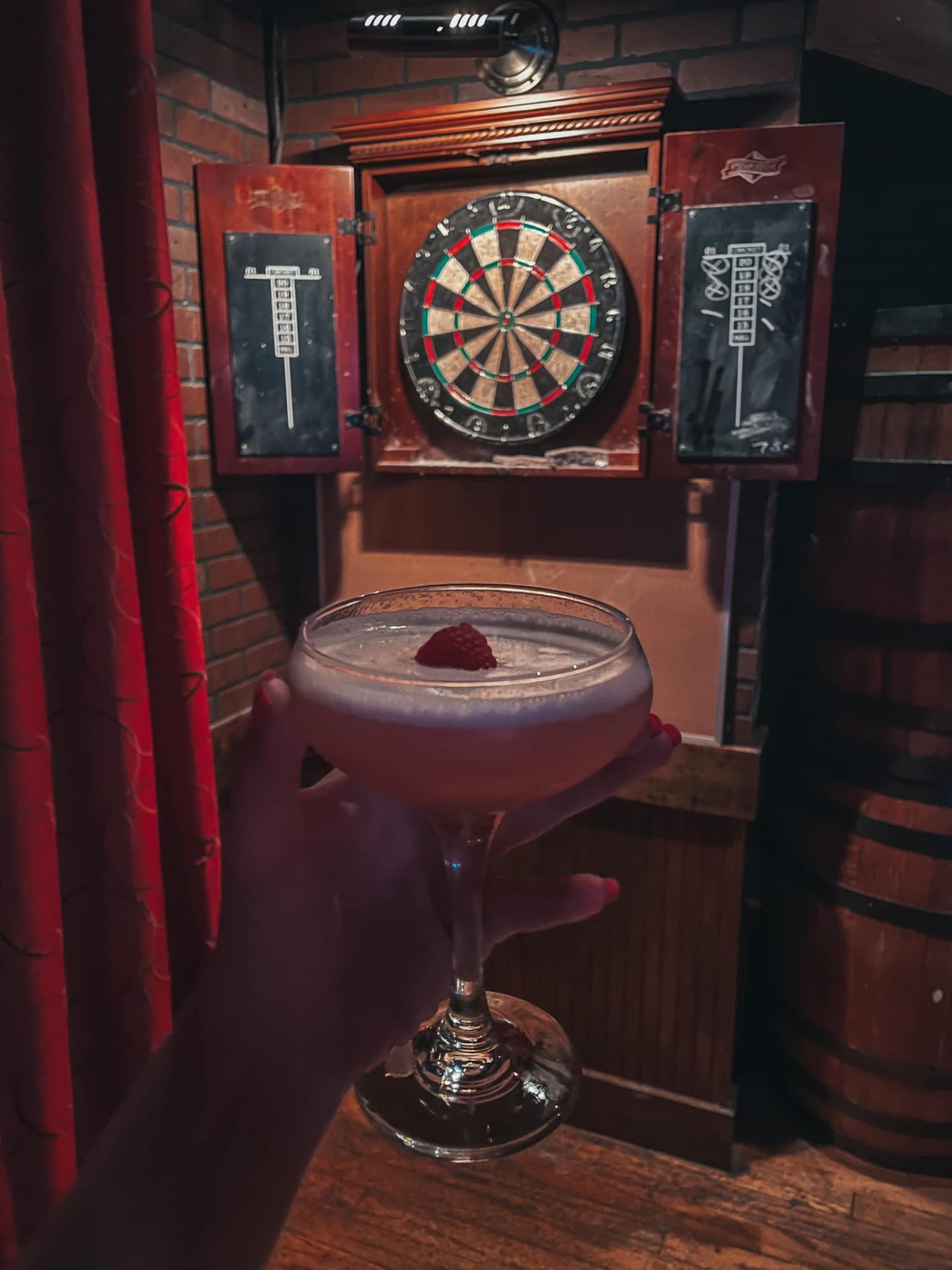 Craft cocktail and dart board at Repeal 18 in Tampa