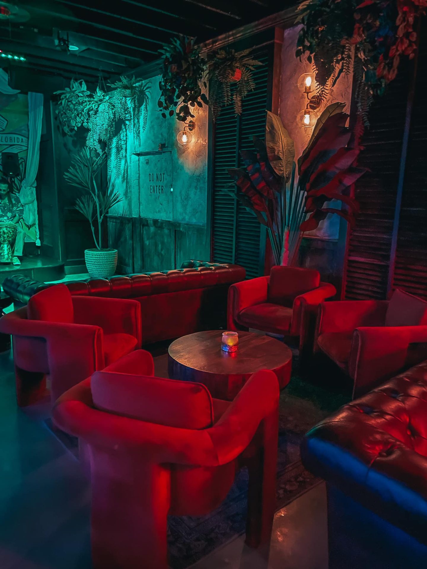 Seating area with intimate lighting at Dirty Laundry speakeasy