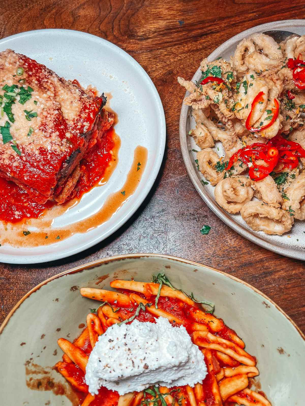 Pasta, lasagna, and calamari from Forbici Italian restaurant in Hyde Park Tampa