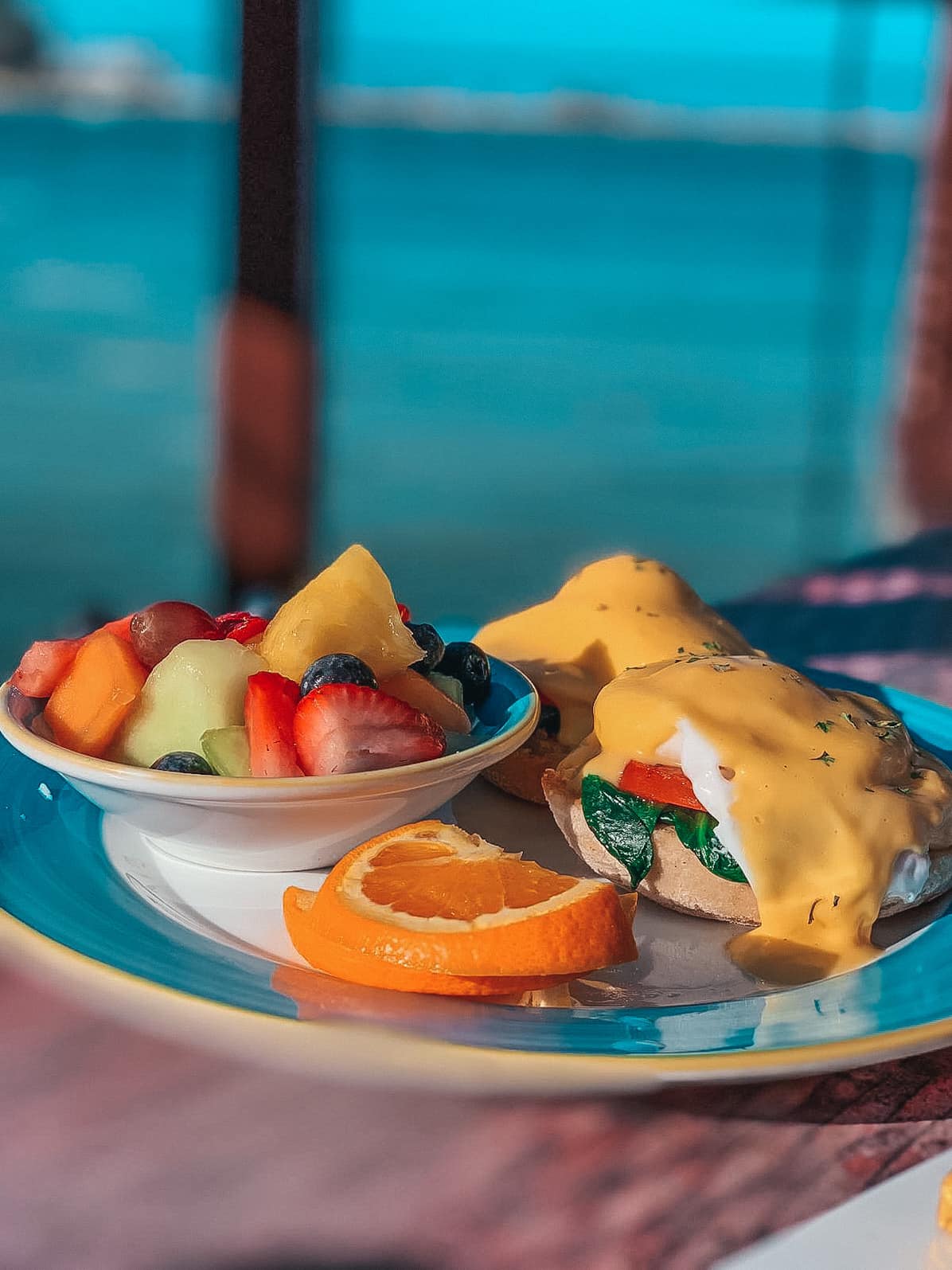 Jimmy's Fish House Clearwater Beach eggs Benedict breakfast with a side of fruit