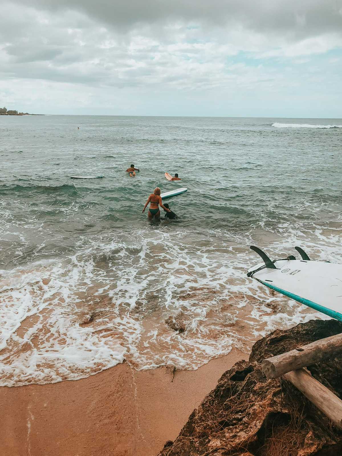 Heading out into the water to get surf lessons on North Shore