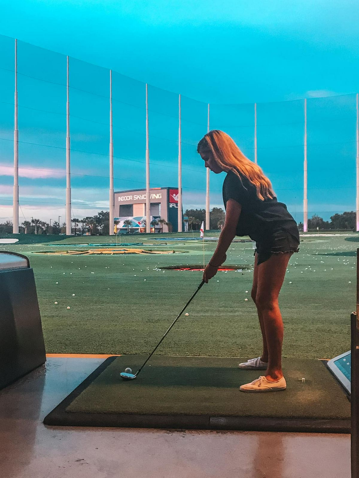 Woman putting at Topgolf