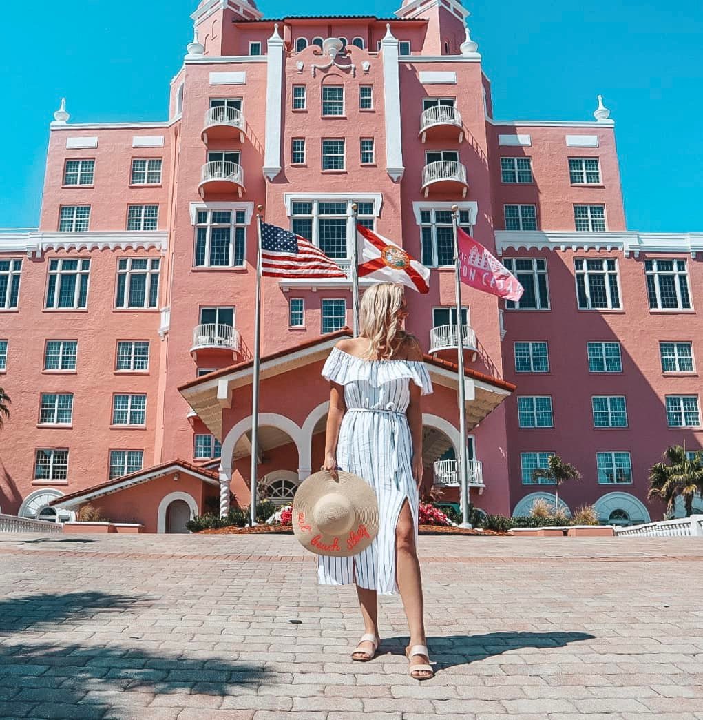 woman standing in front of the don cesar on st pete beach