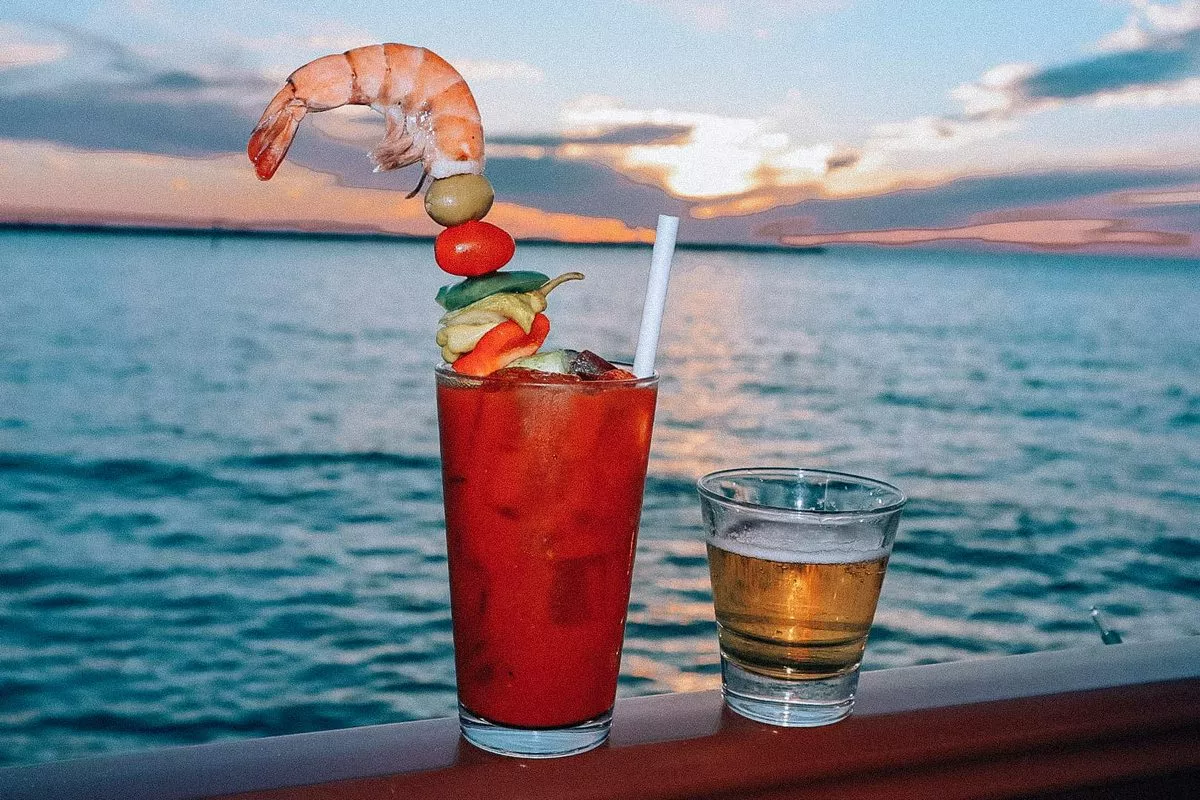 Jimmy's Fish House Clearwater Beach bloody mary with a sunset in the background