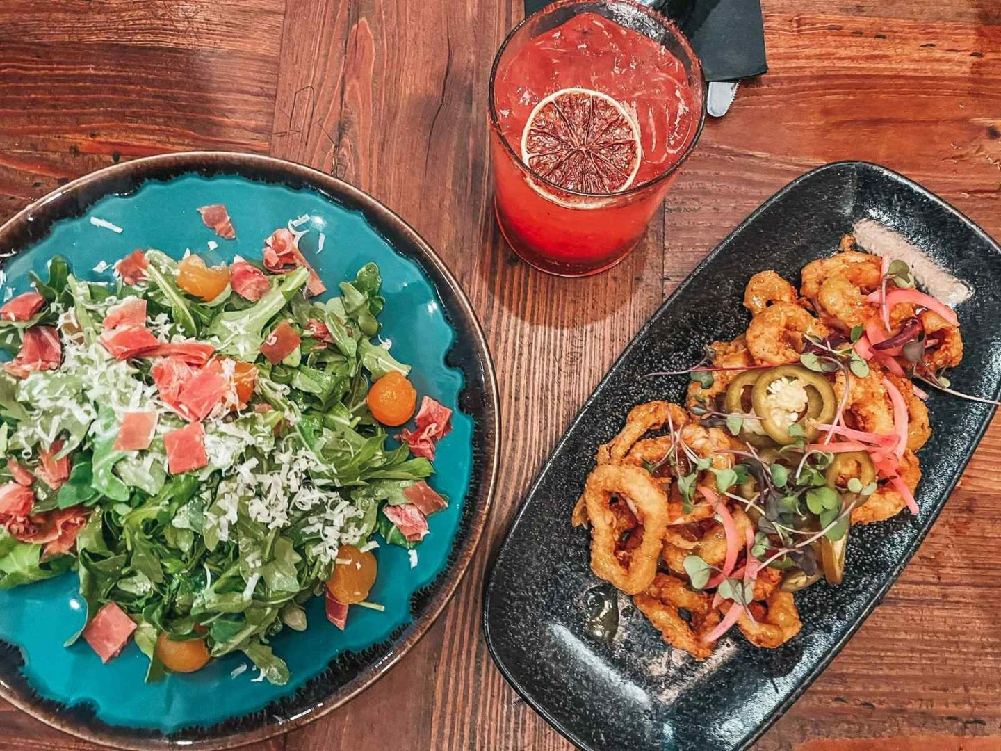 Calamari, salad, and drink from Lakeland Restaurant