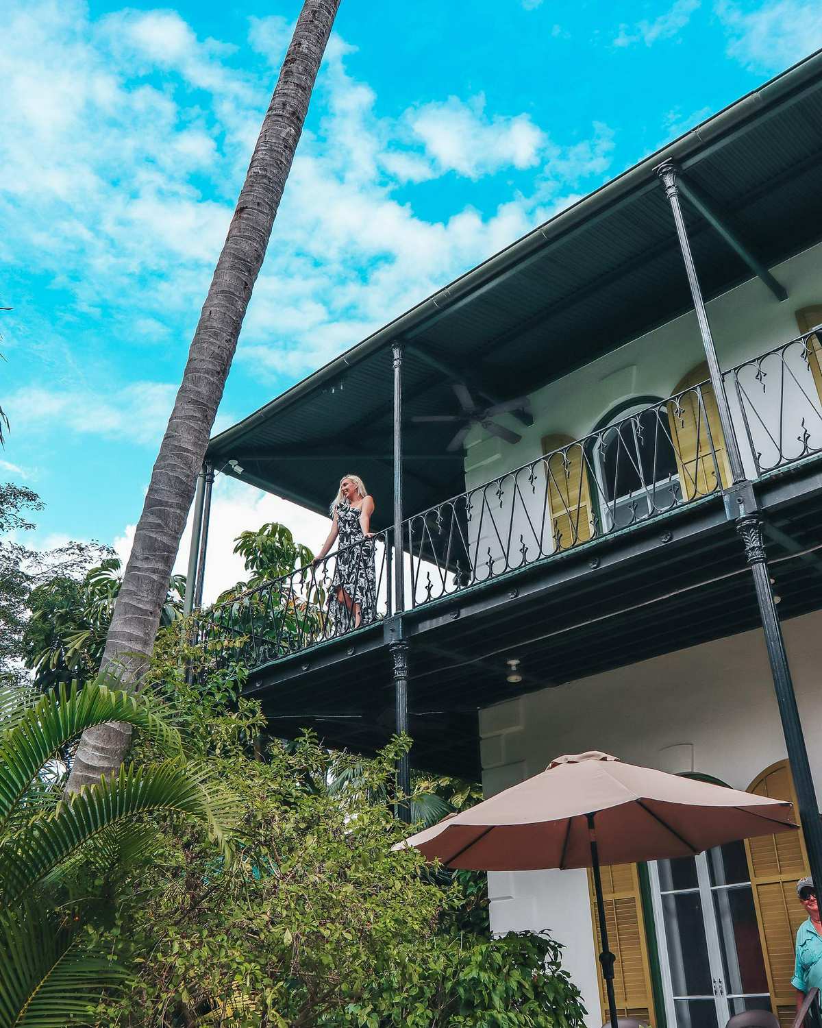 woman outside of the hemingway house and museum in key west