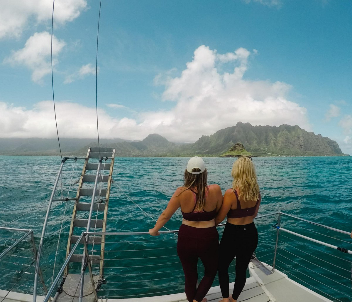 Two friends on a boat tour at Kualoa ranch near Kailua and Kaneohe Oahu