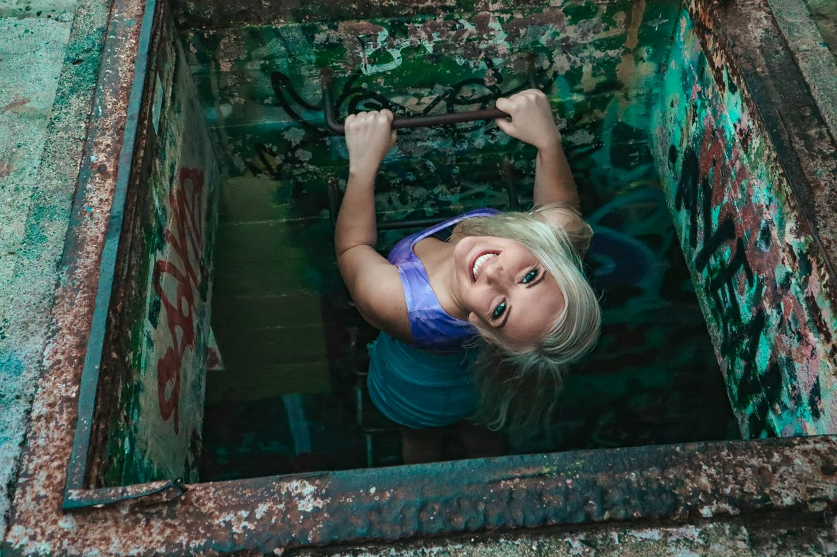 Peeking out of a pillbox at the top of lani kai pillbox hike Kailua Oahu