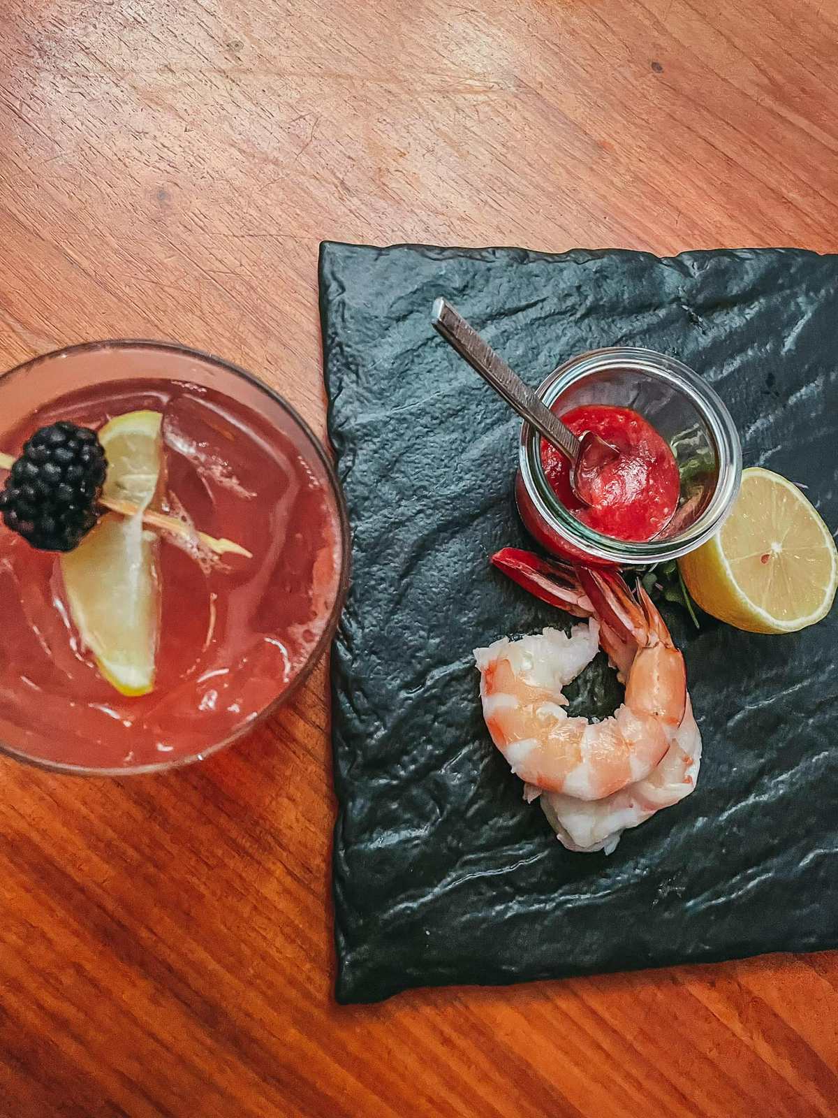 Cocktail and shrimp cocktail from Oystercatchers in Tampa for date night restaurants