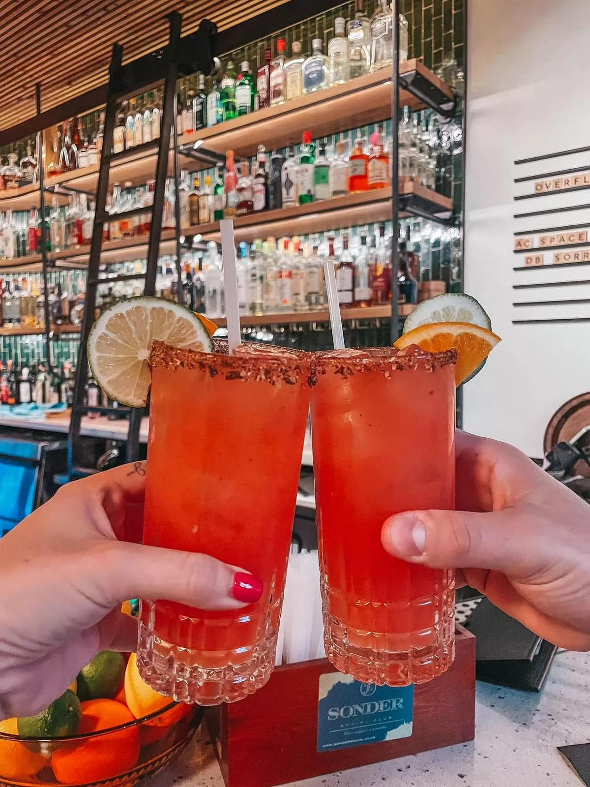 Cheersing drinks at Sonder Social Club in Dunedin