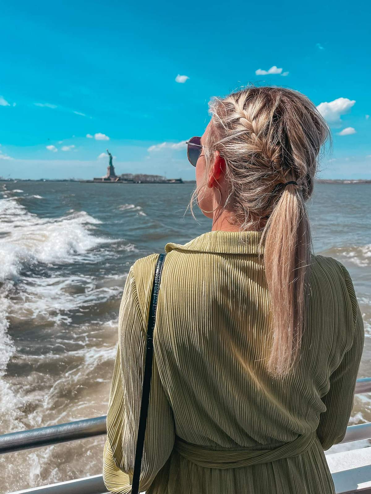 Looking out at the Statue of Liberty from a NYC ferry